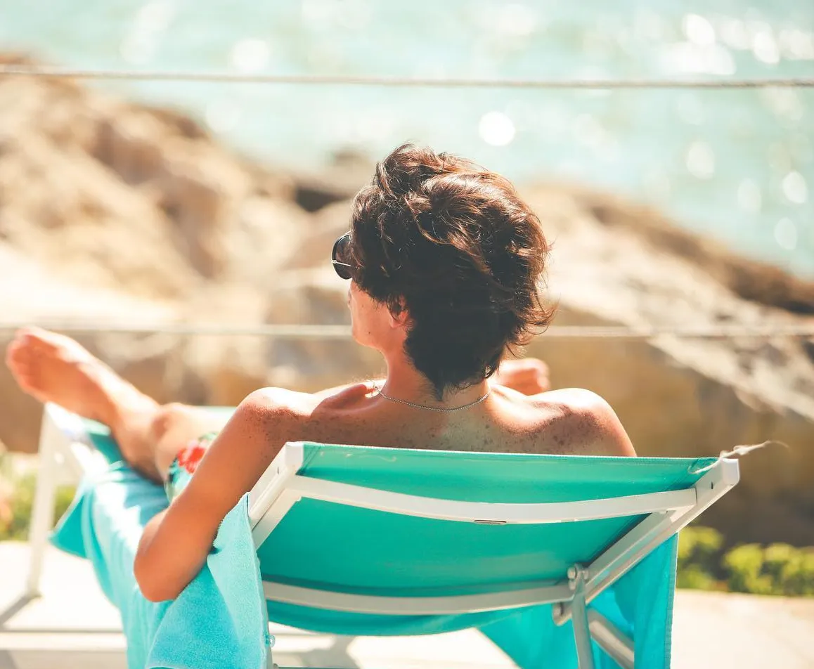 White sun loungers and umbrellas at Anima Beach Palma on Can Pere Antoni beach