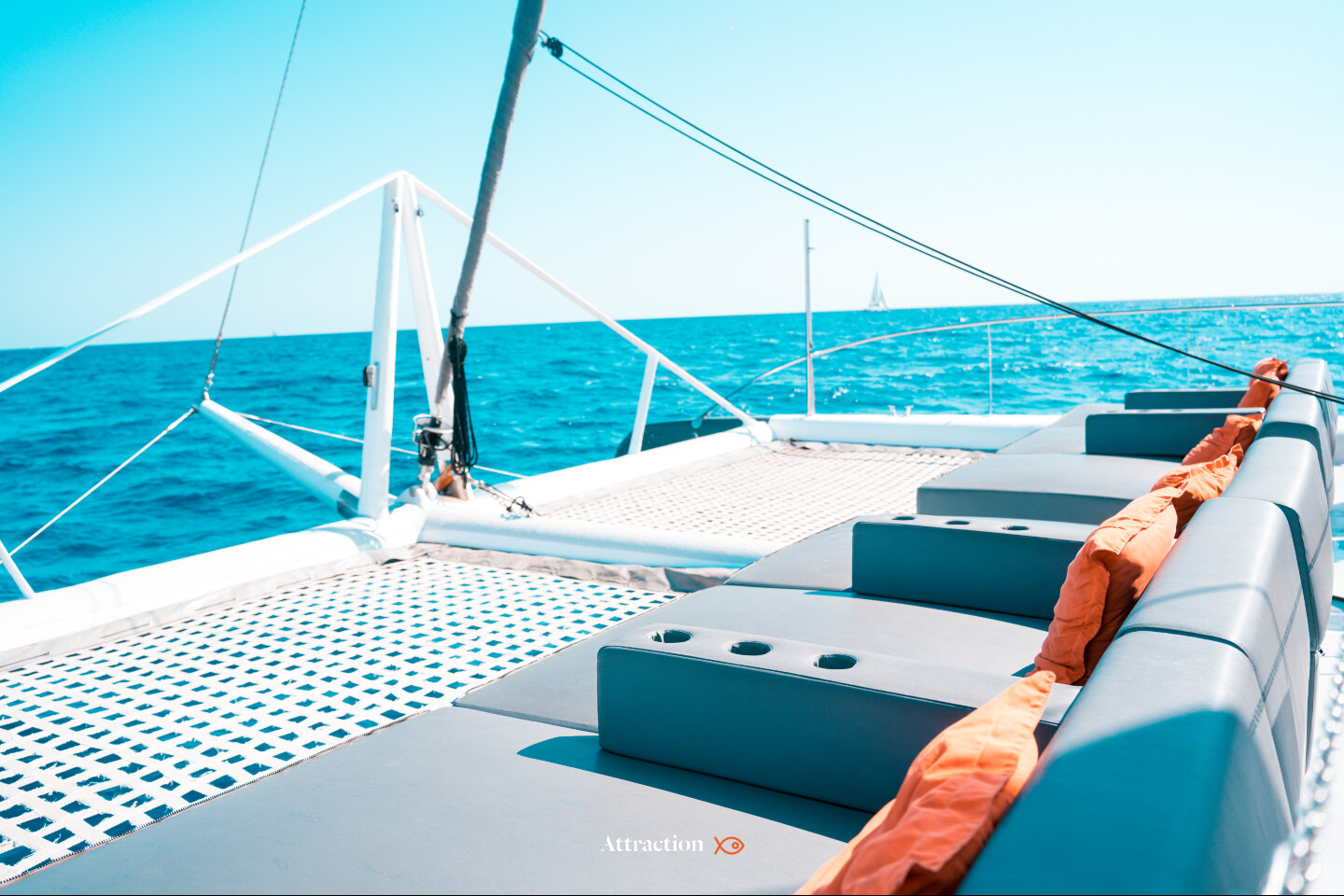 Sunset catamaran excursion by Attraction Catamarans with people on deck