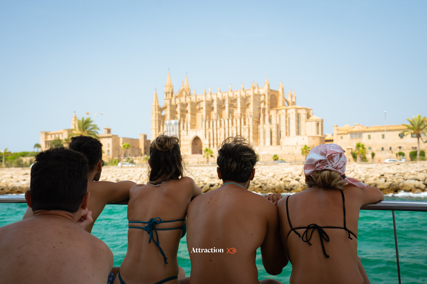 Catamaran of Attraction Catamarans anchored in clear turquoise water near Mallorca coast