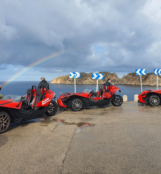 Driver in a red Formula Tours Mallorca car on a scenic mountain road